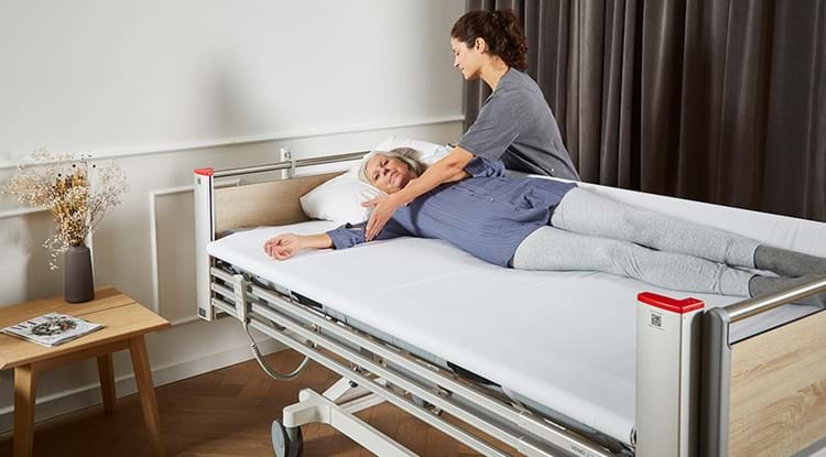 Turning a patient with the powered turning aid