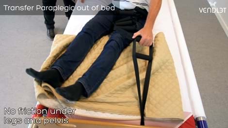 Transfer patient with limited mobility out of bed with aids